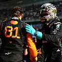 SHANGHAI, CHINA - MARCH 22: Pole position qualifier Oscar Piastri of Australia and McLaren is congratulated by Second placed qualifier George Russell of Great Britain and Mercedes AMG Petronas F1 Team in parc ferme during qualifying ahead of the F1 Grand Prix of China at Shanghai International Circuit on March 22, 2025 in Shanghai, China. (Photo by Bryn Lennon - Formula 1/Formula 1 via Getty Images)