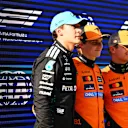 SHANGHAI, CHINA - MARCH 22: Second placed qualifier George Russell of Great Britain and Mercedes AMG Petronas F1 Team Pole position qualifier Oscar Piastri of Australia and McLaren and Third placed qualifier Lando Norris of Great Britain and McLaren looks on during qualifying ahead of the F1 Grand Prix of China at Shanghai International Circuit on March 22, 2025 in Shanghai, China. (Photo by Mark Sutton - Formula 1/Formula 1 via Getty Images)