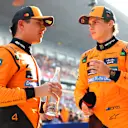 SHANGHAI, CHINA - MARCH 22: Pole position qualifier Oscar Piastri of Australia and McLaren and Third placed qualifier Lando Norris of Great Britain and McLaren talk in parc ferme during qualifying ahead of the F1 Grand Prix of China at Shanghai International Circuit on March 22, 2025 in Shanghai, China. (Photo by Bryn Lennon - Formula 1/Formula 1 via Getty Images)