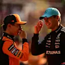 SHANGHAI, CHINA - MARCH 22: Third placed qualifier Lando Norris of Great Britain and McLaren and Second placed qualifier George Russell of Great Britain and Mercedes AMG Petronas F1 Team talk in parc ferme during qualifying ahead of the F1 Grand Prix of China at Shanghai International Circuit on March 22, 2025 in Shanghai, China. (Photo by Mario Renzi - Formula 1/Formula 1 via Getty Images)