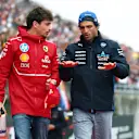 SUZUKA, JAPAN - APRIL 06: Charles Leclerc of Monaco and Scuderia Ferrari and Carlos Sainz of Spain and Williams talk on the drivers parade prior to the F1 Grand Prix of Japan at Suzuka Circuit on April 06, 2025 in Suzuka, Japan. (Photo by Clive Rose/Getty Images)