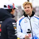 SUZUKA, JAPAN - APRIL 06: Yuki Tsunoda of Japan and Oracle Red Bull Racing and Liam Lawson of New Zealand and Visa Cash App Racing Bulls talk on the drivers parade prior to the F1 Grand Prix of Japan at Suzuka Circuit on April 06, 2025 in Suzuka, Japan. (Photo by Rudy Carezzevoli/Getty Images)