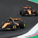 SUZUKA, JAPAN - APRIL 06: Lando Norris of Great Britain driving the (4) McLaren MCL39 Mercedes leads Oscar Piastri of Australia driving the (81) McLaren MCL39 Mercedes on track during the F1 Grand Prix of Japan at Suzuka Circuit on April 06, 2025 in Suzuka, Japan. (Photo by Clive Rose/Getty Images)
