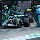 SUZUKA, JAPAN - APRIL 06: Lance Stroll of Canada driving the (18) Aston Martin F1 Team AMR25 Mercedes makes a pitstop during the F1 Grand Prix of Japan at Suzuka Circuit on April 06, 2025 in Suzuka, Japan. (Photo by Mark Thompson/Getty Images)