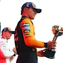 SUZUKA, JAPAN - APRIL 06: Second placed Lando Norris of Great Britain and McLaren on the podium with his trophy during the F1 Grand Prix of Japan at Suzuka Circuit on April 06, 2025 in Suzuka, Japan. (Photo by Bryn Lennon - Formula 1/Formula 1 via Getty Images)