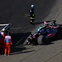 SUZUKA, JAPAN - APRIL 04: Marshals remove the damaged car of Jack Doohan of Australia driving the (7) Alpine F1 A525 Renault from the circuit after a crash during practice ahead of the F1 Grand Prix of Japan at Suzuka Circuit on April 04, 2025 in Suzuka, Japan. (Photo by Bryn Lennon - Formula 1/Formula 1 via Getty Images)