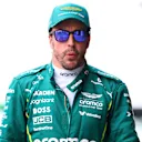 SUZUKA, JAPAN - APRIL 05: Thirteenth placed qualifier Fernando Alonso of Spain and Aston Martin F1 Team looks on in the Pitlane during qualifying ahead of the F1 Grand Prix of Japan at Suzuka Circuit on April 05, 2025 in Suzuka, Japan. (Photo by Bryn Lennon - Formula 1/Formula 1 via Getty Images)