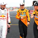 SUZUKA, JAPAN - APRIL 05: Pole position qualifier Max Verstappen of the Netherlands and Oracle Red Bull Racing Third placed qualifier Oscar Piastri of Australia and McLaren and Second placed qualifier Lando Norris of Great Britain and McLaren talk in parc ferme during qualifying ahead of the F1 Grand Prix of Japan at Suzuka Circuit on April 05, 2025 in Suzuka, Japan. (Photo by Bryn Lennon - Formula 1/Formula 1 via Getty Images)