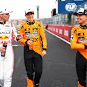 SUZUKA, JAPAN - APRIL 05: Pole position qualifier Max Verstappen of the Netherlands and Oracle Red Bull Racing Third placed qualifier Oscar Piastri of Australia and McLaren and Second placed qualifier Lando Norris of Great Britain and McLaren talk in parc ferme during qualifying ahead of the F1 Grand Prix of Japan at Suzuka Circuit on April 05, 2025 in Suzuka, Japan. (Photo by Bryn Lennon - Formula 1/Formula 1 via Getty Images)