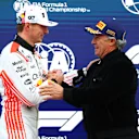 SUZUKA, JAPAN - APRIL 05: Pole position qualifier Max Verstappen of the Netherlands and Oracle Red Bull Racing receives his Pirelli Pole Position Award from former racer Jean Alesi during qualifying ahead of the F1 Grand Prix of Japan at Suzuka Circuit on April 05, 2025 in Suzuka, Japan. (Photo by Bryn Lennon - Formula 1/Formula 1 via Getty Images)