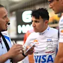 BAHRAIN, BAHRAIN - APRIL 13: Isack Hadjar of France and Visa Cash App Racing Bulls on the grid with engineers during the F1 Grand Prix of Bahrain at Bahrain International Circuit on April 13, 2025 in Bahrain, Bahrain. (Photo by Rudy Carezzevoli/Getty Images)