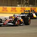 BAHRAIN, BAHRAIN - APRIL 13: Lewis Hamilton of Great Britain driving the (44) Scuderia Ferrari SF-25 leads Max Verstappen of the Netherlands driving the (1) Oracle Red Bull Racing RB21 on track during the F1 Grand Prix of Bahrain at Bahrain International Circuit on April 13, 2025 in Bahrain, Bahrain. (Photo by Clive Mason/Getty Images)