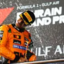 BAHRAIN, BAHRAIN - APRIL 13: Third placed Lando Norris of Great Britain and McLaren celebrates on the podium during the F1 Grand Prix of Bahrain at Bahrain International Circuit on April 13, 2025 in Bahrain, Bahrain. (Photo by Malcolm Griffiths - Formula 1/Formula 1 via Getty Images)