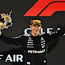 BAHRAIN, BAHRAIN - APRIL 13: Second placed George Russell of Great Britain and Mercedes AMG Petronas F1 Team on the podium with his trophy during the F1 Grand Prix of Bahrain at Bahrain International Circuit on April 13, 2025 in Bahrain, Bahrain. (Photo by Mark Sutton - Formula 1/Formula 1 via Getty Images)