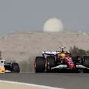 BAHRAIN, BAHRAIN - APRIL 11: Lewis Hamilton of Great Britain driving the (44) Scuderia Ferrari SF-25 leads Liam Lawson of New Zealand driving the (30) Visa Cash App Racing Bulls VCARB 02 on track during practice ahead of the F1 Grand Prix of Bahrain at Bahrain International Circuit on April 11, 2025 in Bahrain, Bahrain. (Photo by Mark Sutton - Formula 1/Formula 1 via Getty Images)