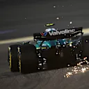 BAHRAIN, BAHRAIN - APRIL 11: Sparks fly behind Fernando Alonso of Spain driving the (14) Aston Martin F1 Team AMR25 Mercedes on track during practice ahead of the F1 Grand Prix of Bahrain at Bahrain International Circuit on April 11, 2025 in Bahrain, Bahrain. (Photo by Clive Mason/Getty Images)