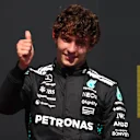 MONTREAL, QUEBEC - JUNE 15: Third placed Andrea Kimi Antonelli of Italy and Mercedes AMG Petronas F1 Team gives a thumbs up on the podium during the F1 Grand Prix of Canada at Circuit Gilles-Villeneuve on June 15, 2025 in Montreal, Quebec. (Photo by Clive Rose/Getty Images)
