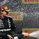MONTREAL, QUEBEC - JUNE 15: Race winner George Russell of Great Britain and Mercedes AMG Petronas F1 Team celebrates on the podium during the F1 Grand Prix of Canada at Circuit Gilles-Villeneuve on June 15, 2025 in Montreal, Quebec. (Photo by Clive Rose/Getty Images)