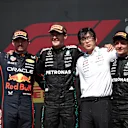 MONTREAL, QUEBEC - JUNE 15: Race winner George Russell of Great Britain and Mercedes AMG Petronas F1 Team Second placed Max Verstappen of the Netherlands and Oracle Red Bull Racing Third placed Andrea Kimi Antonelli of Italy and Mercedes AMG Petronas F1 Team and Katsu Kuwahara, Performance Engineer, Mercedes AMG Petronas F1 Team on the podium during the F1 Grand Prix of Canada at Circuit Gilles-Villeneuve on June 15, 2025 in Montreal, Quebec. (Photo by Jared C. Tilton - Formula 1/Formula 1 via Getty Images)