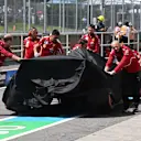 MONTREAL, QUEBEC - JUNE 13: The damaged car of Charles Leclerc of Monaco and Scuderia Ferrari is returned to the garage under a cover during practice ahead of the F1 Grand Prix of Canada at Circuit Gilles-Villeneuve on June 13, 2025 in Montreal, Quebec. (Photo by Mark Sutton - Formula 1/Formula 1 via Getty Images)