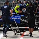 MONTREAL, QUEBEC - JUNE 14: The damaged car of Alexander Albon of Thailand driving the (23) Williams FW47 Mercedes is returned to the garage during qualifying ahead of the F1 Grand Prix of Canada at Circuit Gilles-Villeneuve on June 14, 2025 in Montreal, Quebec. (Photo by Rudy Carezzevoli/Getty Images)