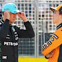 MONTREAL, QUEBEC - JUNE 14: Pole position qualifier George Russell of Great Britain and Mercedes AMG Petronas F1 Team and Third placed qualifier Oscar Piastri of Australia and McLaren in parc ferme during qualifying ahead of the F1 Grand Prix of Canada at Circuit Gilles-Villeneuve on June 14, 2025 in Montreal, Quebec. (Photo by Mark Thompson/Getty Images)
