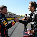 MONTREAL, QUEBEC - JUNE 14: Pole position qualifier George Russell of Great Britain and Mercedes AMG Petronas F1 Team and Second placed qualifier Max Verstappen of the Netherlands and Oracle Red Bull Racing shake hands in parc ferme during qualifying ahead of the F1 Grand Prix of Canada at Circuit Gilles-Villeneuve on June 14, 2025 in Montreal, Quebec. (Photo by Mark Sutton - Formula 1/Formula 1 via Getty Images)