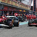 IMOLA, ITALY - MAY 18: Charles Leclerc of Monaco driving the (16) Scuderia Ferrari SF-25 and Oliver Bearman of Great Britain driving the (87) Haas F1 VF-25 Ferrari in the pitlane during the F1 Grand Prix of Emilia-Romagna at Autodromo Internazionale Enzo e Dino Ferrari on May 18, 2025 in Imola, Italy. (Photo by Mark Thompson/Getty Images)