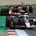 IMOLA, ITALY - MAY 18: Oliver Bearman of Great Britain driving the (87) Haas F1 VF-25 Ferrari leads Yuki Tsunoda of Japan driving the (22) Oracle Red Bull Racing RB21 and Charles Leclerc of Monaco driving the (16) Scuderia Ferrari SF-25 on track during the F1 Grand Prix of Emilia-Romagna at Autodromo Internazionale Enzo e Dino Ferrari on May 18, 2025 in Imola, Italy. (Photo by Mark Sutton - Formula 1/Formula 1 via Getty Images)