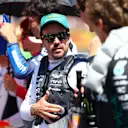 IMOLA, ITALY - MAY 18: Fernando Alonso of Spain and Aston Martin F1 Team and George Russell of Great Britain and Mercedes AMG Petronas F1 Team talk on the grid during the F1 Grand Prix of Emilia-Romagna at Autodromo Internazionale Enzo e Dino Ferrari on May 18, 2025 in Imola, Italy. (Photo by Bryn Lennon - Formula 1/Formula 1 via Getty Images)