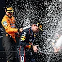 IMOLA, ITALY - MAY 18: Race winner Max Verstappen of the Netherlands and Oracle Red Bull Racing and Third placed Oscar Piastri of Australia and McLaren celebrates on the podium with Champagne during the F1 Grand Prix of Emilia-Romagna at Autodromo Internazionale Enzo e Dino Ferrari on May 18, 2025 in Imola, Italy. (Photo by Clive Rose/Getty Images)