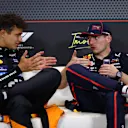 IMOLA, ITALY - MAY 18: Second placed Lando Norris of Great Britain and McLaren and Race winner Max Verstappen of the Netherlands and Oracle Red Bull Racing talk in the Drivers Press Conference during the F1 Grand Prix of Emilia-Romagna at Autodromo Internazionale Enzo e Dino Ferrari on May 18, 2025 in Imola, Italy. (Photo by Clive Rose/Getty Images)