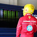 IMOLA, ITALY - MAY 17: Twelfth placed qualifier Lewis Hamilton of Great Britain and Scuderia Ferrari checks the timing screens during qualifying ahead of the F1 Grand Prix of Emilia-Romagna at Autodromo Internazionale Enzo e Dino Ferrari on May 17, 2025 in Imola, Italy. (Photo by Bryn Lennon - Formula 1/Formula 1 via Getty Images)