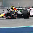 MIAMI, FLORIDA - MAY 04: Yuki Tsunoda of Japan driving the (22) Oracle Red Bull Racing RB21 leads Esteban Ocon of France driving the (31) Haas F1 VF-25 Ferrari on track during the F1 Grand Prix of Miami at Miami International Autodrome on May 04, 2025 in Miami, Florida. (Photo by Mark Thompson/Getty Images)