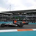 MIAMI, FLORIDA - MAY 04: Oliver Bearman of Great Britain driving the (87) Haas F1 VF-25 Ferrari leads Yuki Tsunoda of Japan driving the (22) Oracle Red Bull Racing RB21 on track during the F1 Grand Prix of Miami at Miami International Autodrome on May 04, 2025 in Miami, Florida. (Photo by Rudy Carezzevoli/Getty Images)