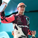 MIAMI, FLORIDA - MAY 04: Third placed George Russell of Great Britain and Mercedes AMG Petronas F1 Team with his trophy during the F1 Grand Prix of Miami at Miami International Autodrome on May 04, 2025 in Miami, Florida. (Photo by Bryn Lennon - Formula 1/Formula 1 via Getty Images)