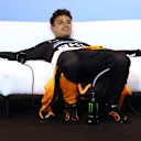 MIAMI, FLORIDA - MAY 04: Second placed Lando Norris of Great Britain and McLaren lays down in the Drivers Press Conference during the F1 Grand Prix of Miami at Miami International Autodrome on May 04, 2025 in Miami, Florida. (Photo by Clive Rose/Getty Images)