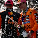 MIAMI, FLORIDA - MAY 04: Race winner Oscar Piastri of Australia and McLaren and Second placed Lando Norris of Great Britain and McLaren celebrate on the podium during the F1 Grand Prix of Miami at Miami International Autodrome on May 04, 2025 in Miami, Florida. (Photo by Mario Renzi - Formula 1/Formula 1 via Getty Images)