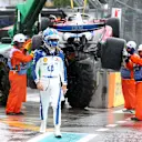 MIAMI, FLORIDA - MAY 03: Marshals remove the car of Charles Leclerc of Monaco driving the (16) Scuderia Ferrari SF-25 from the circuit after a crash on the way to the grid during the Sprint ahead of the F1 Grand Prix of Miami at Miami International Autodrome on May 03, 2025 in Miami, Florida. (Photo by Clive Rose/Getty Images)