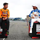 MIAMI, FLORIDA - MAY 03: Sprint winner Lando Norris of Great Britain and McLaren and Third placed Lewis Hamilton of Great Britain and Scuderia Ferrari talk in parc ferme during the Sprint ahead of the F1 Grand Prix of Miami at Miami International Autodrome on May 03, 2025 in Miami, Florida. (Photo by Bryn Lennon - Formula 1/Formula 1 via Getty Images)
