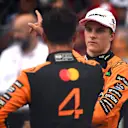 MIAMI, FLORIDA - MAY 03: Second placed Oscar Piastri of Australia and McLaren and Sprint winner Lando Norris of Great Britain and McLaren talk in parc ferme during the Sprint ahead of the F1 Grand Prix of Miami at Miami International Autodrome on May 03, 2025 in Miami, Florida. (Photo by Rudy Carezzevoli/Getty Images)