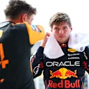 MIAMI, FLORIDA - MAY 03: Pole position qualifier Max Verstappen of the Netherlands and Oracle Red Bull Racing and Second placed qualifier Lando Norris of Great Britain and McLaren talk in parc ferme during qualifying ahead of the F1 Grand Prix of Miami at Miami International Autodrome on May 03, 2025 in Miami, Florida. (Photo by Bryn Lennon - Formula 1/Formula 1 via Getty Images)
