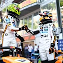 MONTE-CARLO, MONACO - MAY 24: Pole position qualifier Lando Norris of Great Britain and McLaren and Third placed qualifier Oscar Piastri of Australia and McLaren congratulate each other in parc ferme during qualifying ahead of the F1 Grand Prix of Monaco at Circuit de Monaco on May 24, 2025 in Monte-Carlo, Monaco (Photo by Bryn Lennon - Formula 1/Formula 1 via Getty Images)