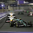 JEDDAH, SAUDI ARABIA - APRIL 20: Fernando Alonso of Spain driving the (14) Aston Martin F1 Team AMR25 Mercedes leads Isack Hadjar of France driving the (6) Visa Cash App Racing Bulls VCARB 02 and Liam Lawson of New Zealand driving the (30) Visa Cash App Racing Bulls VCARB 02 on track during the F1 Grand Prix of Saudi Arabia at Jeddah Corniche Circuit on April 20, 2025 in Jeddah, Saudi Arabia. (Photo by Mark Sutton - Formula 1/Formula 1 via Getty Images)