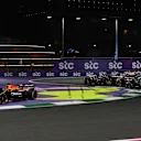 JEDDAH, SAUDI ARABIA - APRIL 20: Max Verstappen of the Netherlands driving the (1) Oracle Red Bull Racing RB21 runs wide as Oscar Piastri of Australia driving the (81) McLaren MCL39 Mercedes leads George Russell of Great Britain driving the (63) Mercedes AMG Petronas F1 Team W16 and the rest of the field at the start during the F1 Grand Prix of Saudi Arabia at Jeddah Corniche Circuit on April 20, 2025 in Jeddah, Saudi Arabia. (Photo by Rudy Carezzevoli/Getty Images)