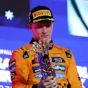 JEDDAH, SAUDI ARABIA - APRIL 20: Race winner Oscar Piastri of Australia and McLaren on the podium with his trophy during the F1 Grand Prix of Saudi Arabia at Jeddah Corniche Circuit on April 20, 2025 in Jeddah, Saudi Arabia. (Photo by Meg Oliphant/Getty Images)