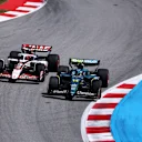 BARCELONA, SPAIN - JUNE 01: Fernando Alonso of Spain driving the (14) Aston Martin F1 Team AMR25 Mercedes and Esteban Ocon of France driving the (31) Haas F1 VF-25 Ferrari battle for track position on track during the F1 Grand Prix of Spain at Circuit de Barcelona-Catalunya on June 01, 2025 in Barcelona, Spain. (Photo by Clive Rose - Formula 1/Formula 1 via Getty Images)
