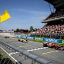 BARCELONA, SPAIN - JUNE 01: Lewis Hamilton of Great Britain driving the (44) Scuderia Ferrari SF-25 leads Isack Hadjar of France driving the (6) Visa Cash App Racing Bulls VCARB 02 on track as a marshal waves the yellow flag during the F1 Grand Prix of Spain at Circuit de Barcelona-Catalunya on June 01, 2025 in Barcelona, Spain. (Photo by David Ramos/Getty Images)