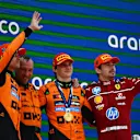 BARCELONA, SPAIN - JUNE 01: Race winner Oscar Piastri of Australia and McLaren Second placed Lando Norris of Great Britain and McLaren Third placed Charles Leclerc of Monaco and Scuderia Ferrari and the McLaren trophy delegate on the podium during the F1 Grand Prix of Spain at Circuit de Barcelona-Catalunya on June 01, 2025 in Barcelona, Spain. (Photo by Clive Rose - Formula 1/Formula 1 via Getty Images)