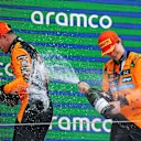BARCELONA, SPAIN - JUNE 01: Race winner Oscar Piastri of Australia and McLaren and Second placed Lando Norris of Great Britain and McLaren celebrate on the podium during the F1 Grand Prix of Spain at Circuit de Barcelona-Catalunya on June 01, 2025 in Barcelona, Spain. (Photo by Mark Thompson/Getty Images)